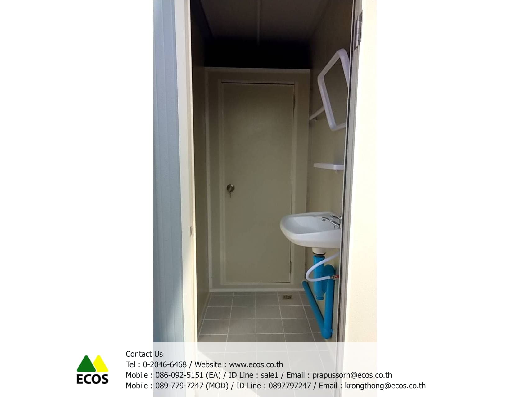 Inside the WT-Toilet, looking in from the doorway: the inner cubicle door, a tiled floor with a drain, and the wash basin with its mirror and shelf on the right